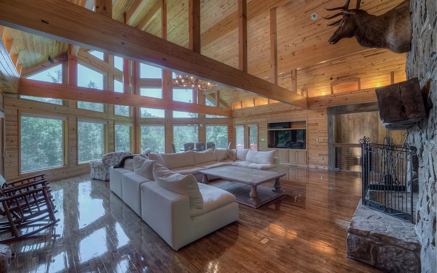 A large cabin living room with wood floors